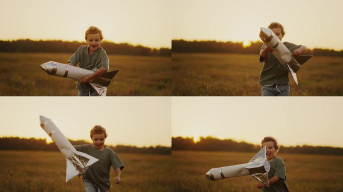 快乐的小男孩在夏天的草地上奔跑，手里拿着玩具火箭，慢动作肖像