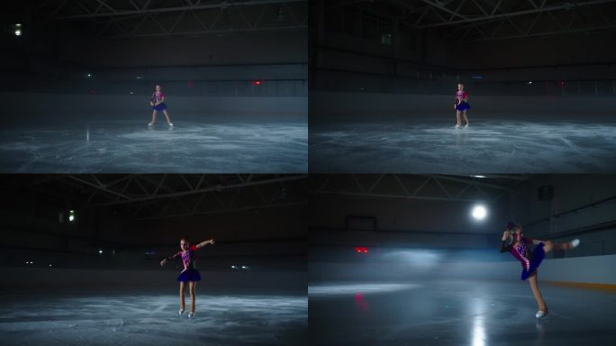 花样滑冰小女孩在运动场黑暗的溜冰场上训练表演花样