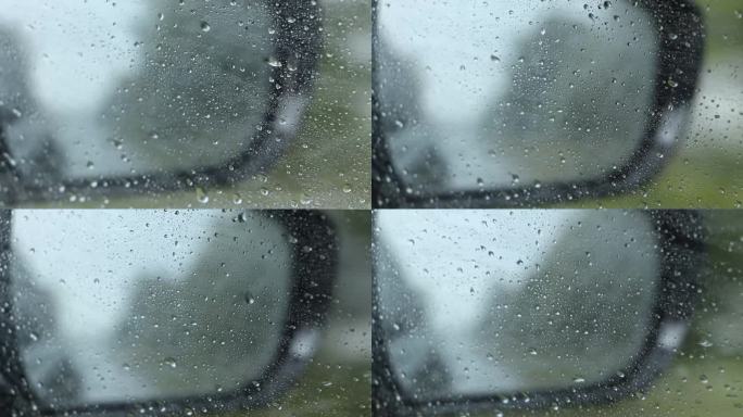 窗外下雨，从汽车后视镜里看高速行驶的汽车，在汽车里行驶的汽车，在雨中行驶的汽车，天气
