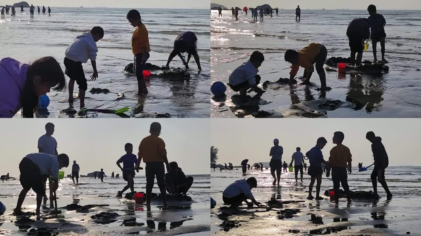 大海亲子活动假日暑假小朋友在海边沙滩玩耍