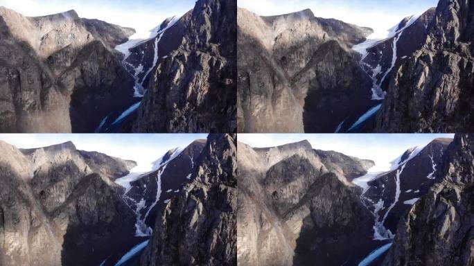大冰川和山峰的俯视图。空中无人机展示了一幅美丽的景观和巨大的岩石。永雪藏山。