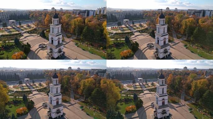 摩尔多瓦基希讷乌的中央公园，钟楼和耶稣诞生大教堂的尖塔全景，背景是多座办公和住宅建筑。4 k的视频