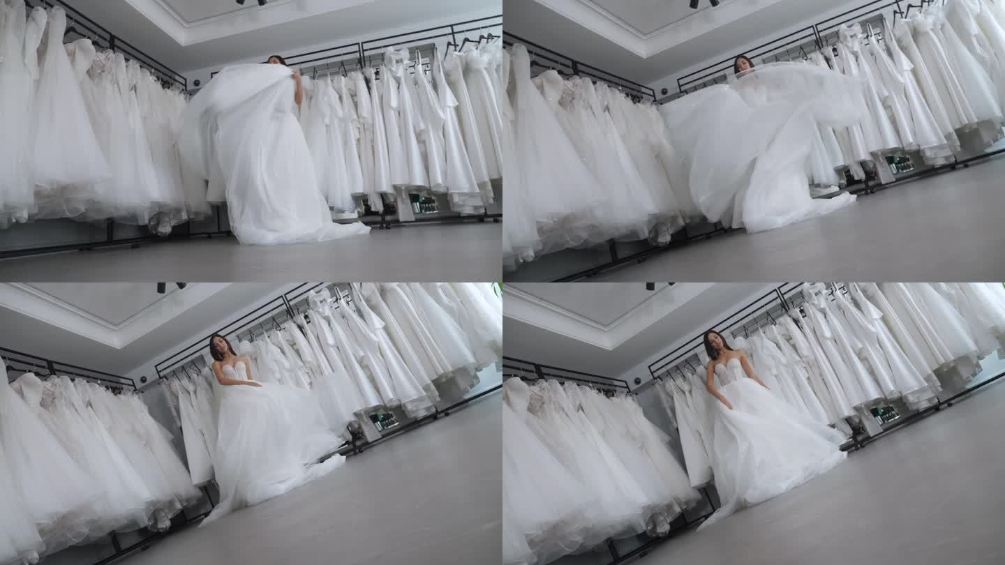 新娘在婚礼沙龙里，她在纺纱，裙子在飘动。
