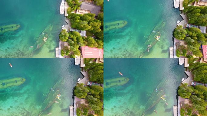 沉船:靠近海岸的水面下的沉船或沉船航拍无人机俯视图。