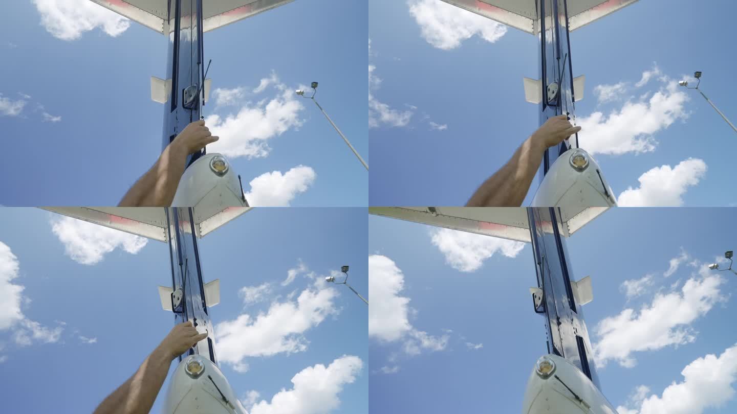 多云天空背景下私人飞机尾部的低角度拍摄。用于产生飞机偏航运动的尾翼后舵的人工检查