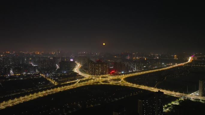 中秋节月光下的城市立交桥夜景车流航拍