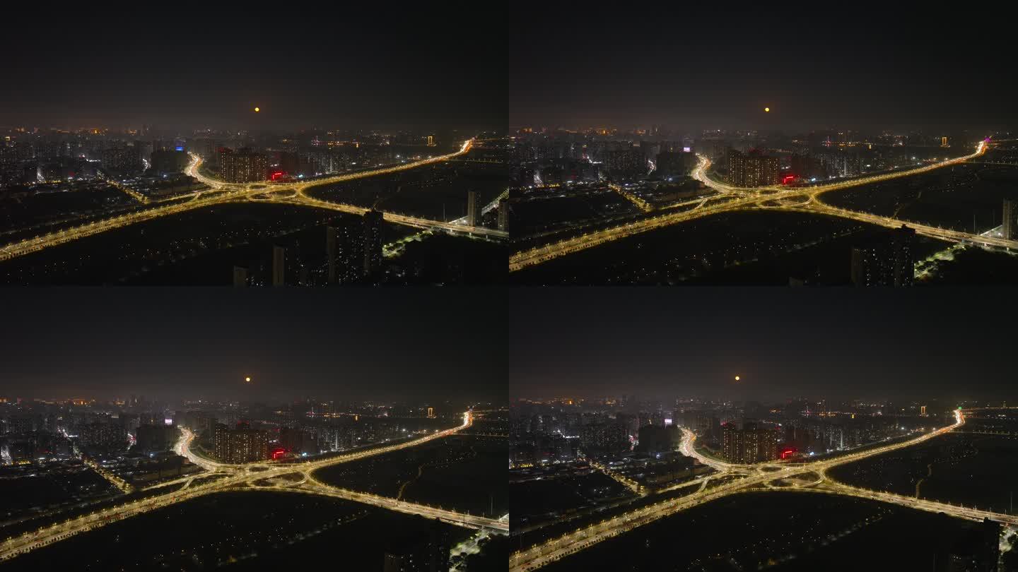 中秋节月光下的城市立交桥夜景车流航拍