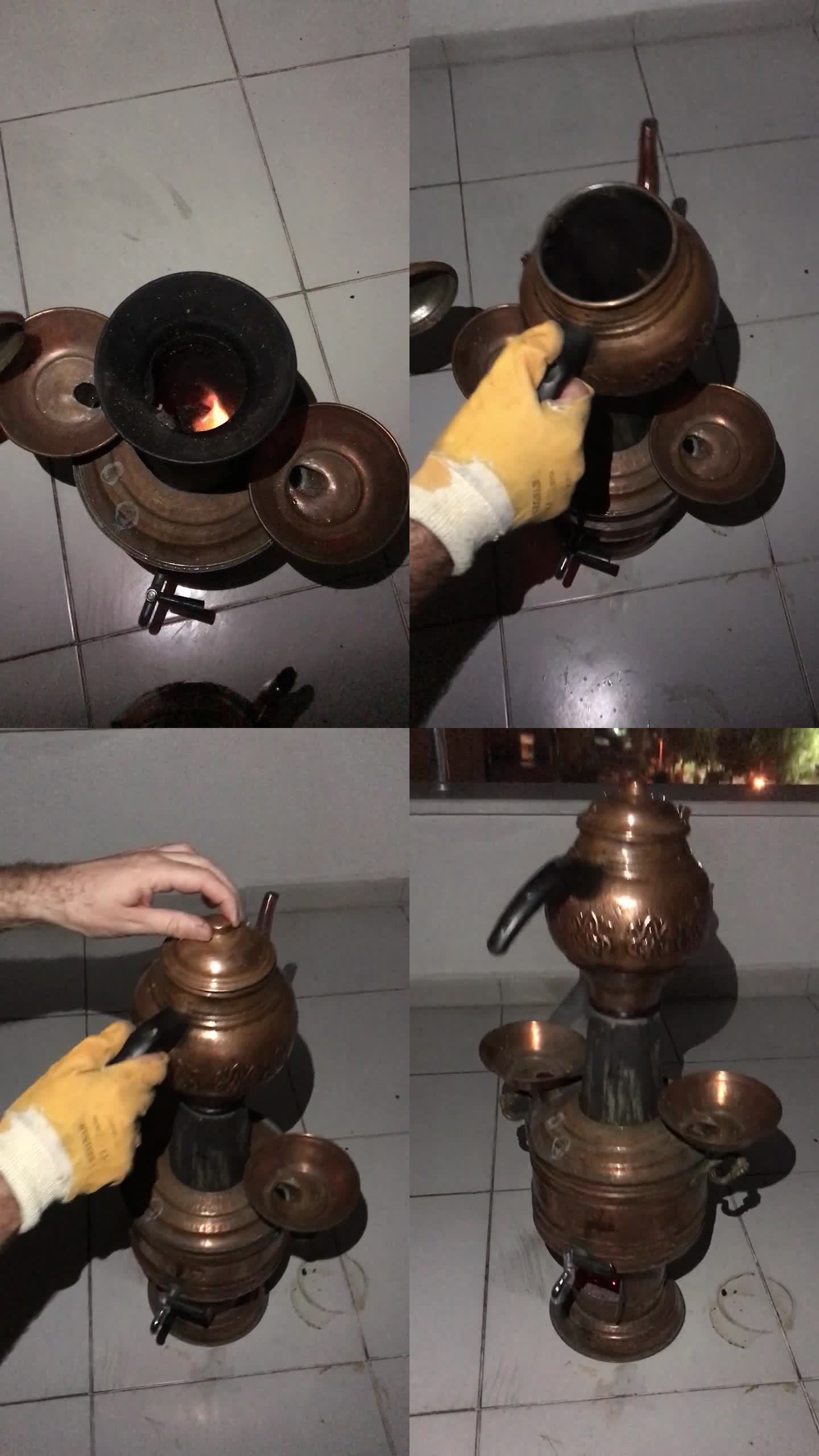 木头上的土耳其茶炊。一个人把开水倒进壶里，放在火上。外面是晚上。垂直视频。
