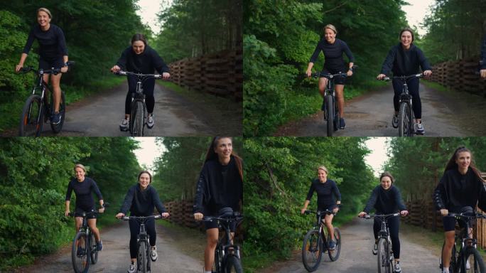 快乐的多元女性夏日周末在森林里骑自行车，家人在大自然中休息