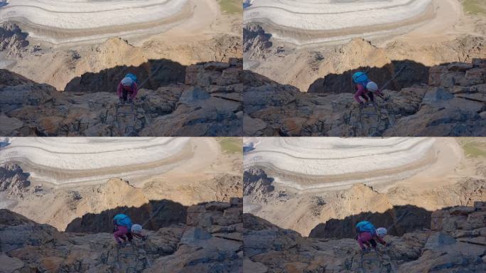 一名女子在夏季攀登阿尔卑斯山脉的路线