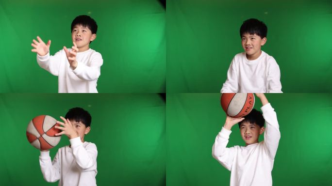 帅气的中国小男孩在玩篮球接住篮球慢镜头