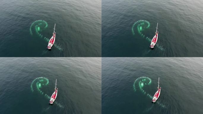 空中无人机拍摄的一艘两栖船在Jokulsarlon的冰山之间航行的视频