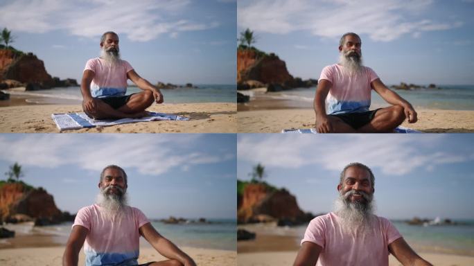 在海边天堂岛的沙滩上，老人在海浪声中冥想，坐着莲花式。在异国情调的海岸，黑人男高年级学生盘腿练习瑜伽