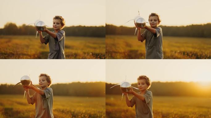 未来宇航员的肖像，夏天在草地上玩玩具火箭的小男孩，慢镜头