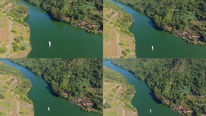 从空中俯瞰游船在河Miño在Belesar村和水库，里贝拉萨克拉，加利西亚西班牙。