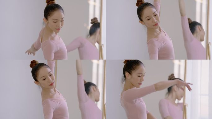 女人对着镜子跳芭蕾。