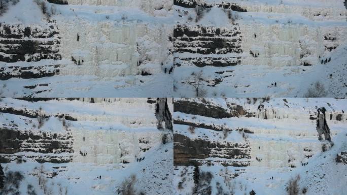 空中回拉拍摄显示在陡峭的雪山壁的冰登山者在普罗沃峡谷，犹他州