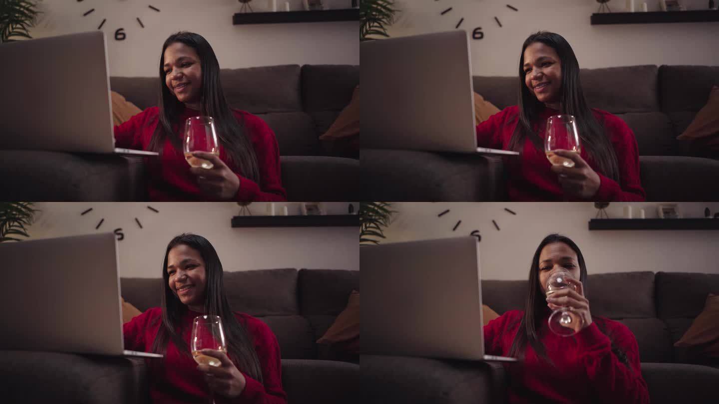 非裔美国妇女在家里用笔记本电脑上网交流的特写