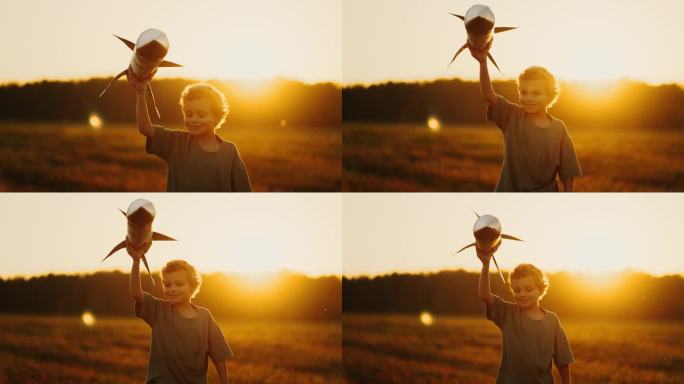 夕阳下无忧无虑的小男孩在田野里玩着玩具火箭，梦想着太空旅行