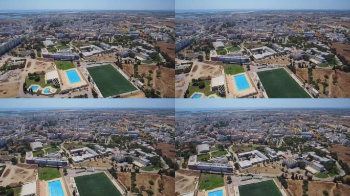 无人机在葡萄牙法鲁市拍摄的一段视频画面，上面是一座体育场馆、体育场和大学。