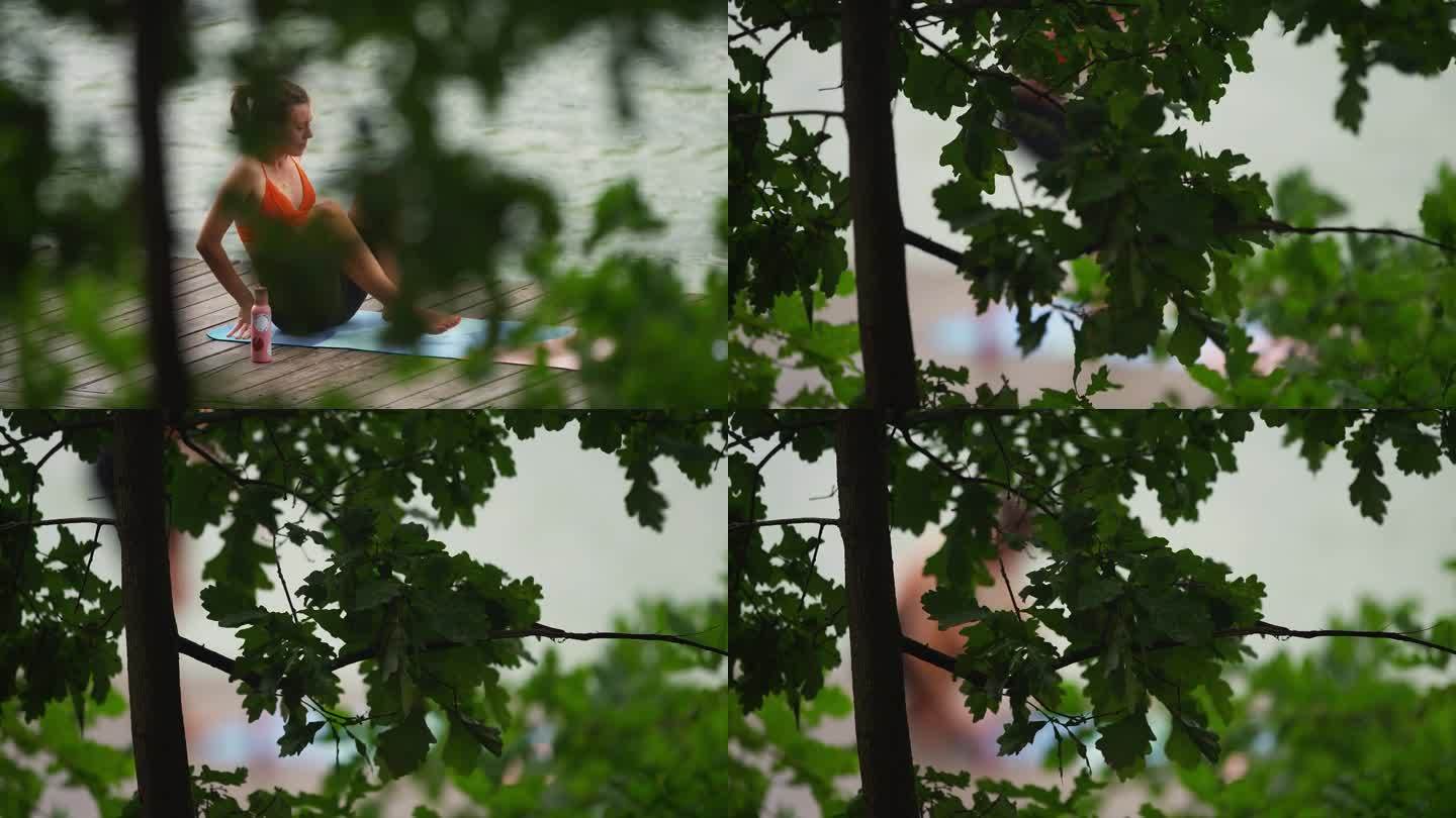 在湖边运动的女人。疲惫不堪的我在木码头上休息，欣赏着美丽的景色