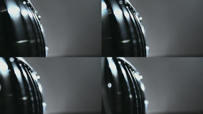 特写镜头盘闪亮的反光黑色金属表面的一个全新的蜡车格栅上的引擎盖