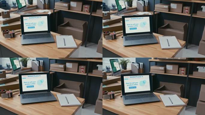 笔记本电脑的屏幕与网上市场的主页和笔记本放在桌上