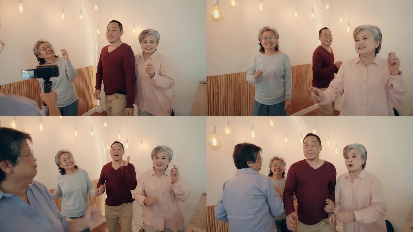 亚洲老年朋友在家跳舞自拍庆祝幸福。