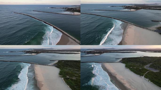 澳大利亚新南威尔士州日出时，伊卢卡海滩海岸线上的泡沫海浪。-天线盘