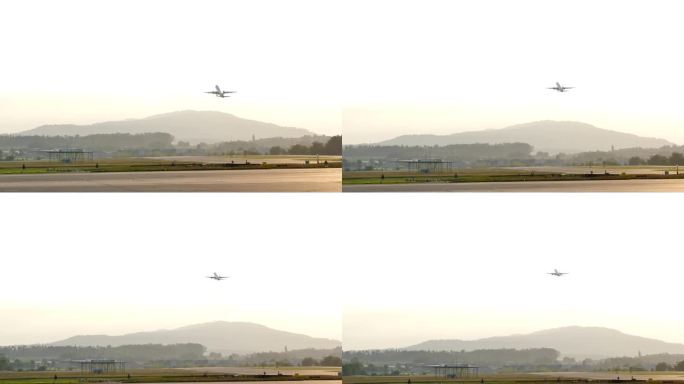 日落时飞机起飞的广角镜头，山的背景