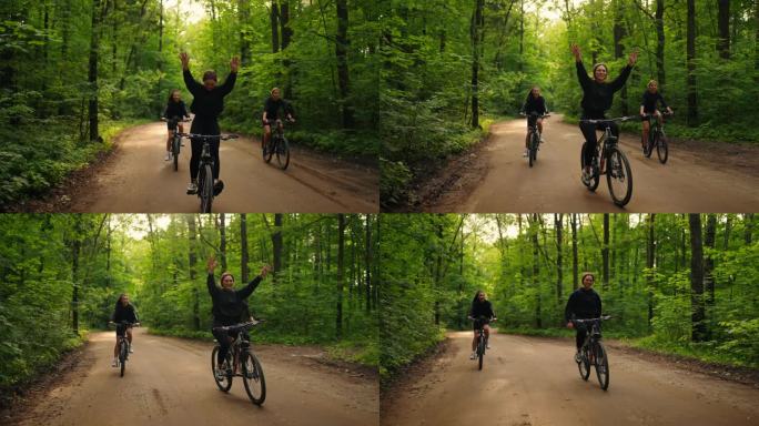 骑自行车的女子双手举起，面带微笑，在自行车上表演特技