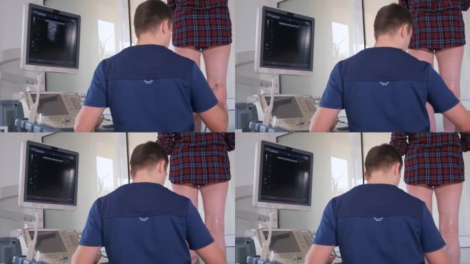 超声医生在他的办公室里检查一位妇女的下肢。