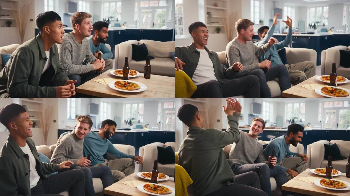 一群兴奋的男性朋友在电视上观看体育比赛，并在家里一起吃披萨庆祝