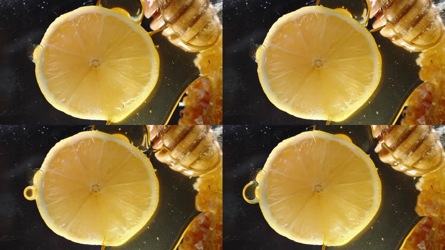 从下面透过玻璃桌子看柠檬片，蜂蜜从上面滴下来。特写镜头。