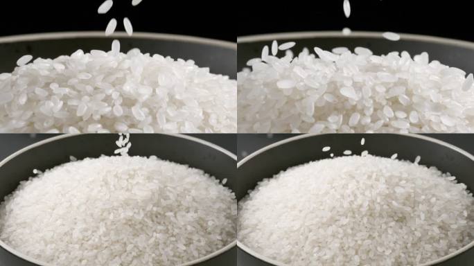 在黑背景上大米洒落到白色碗中