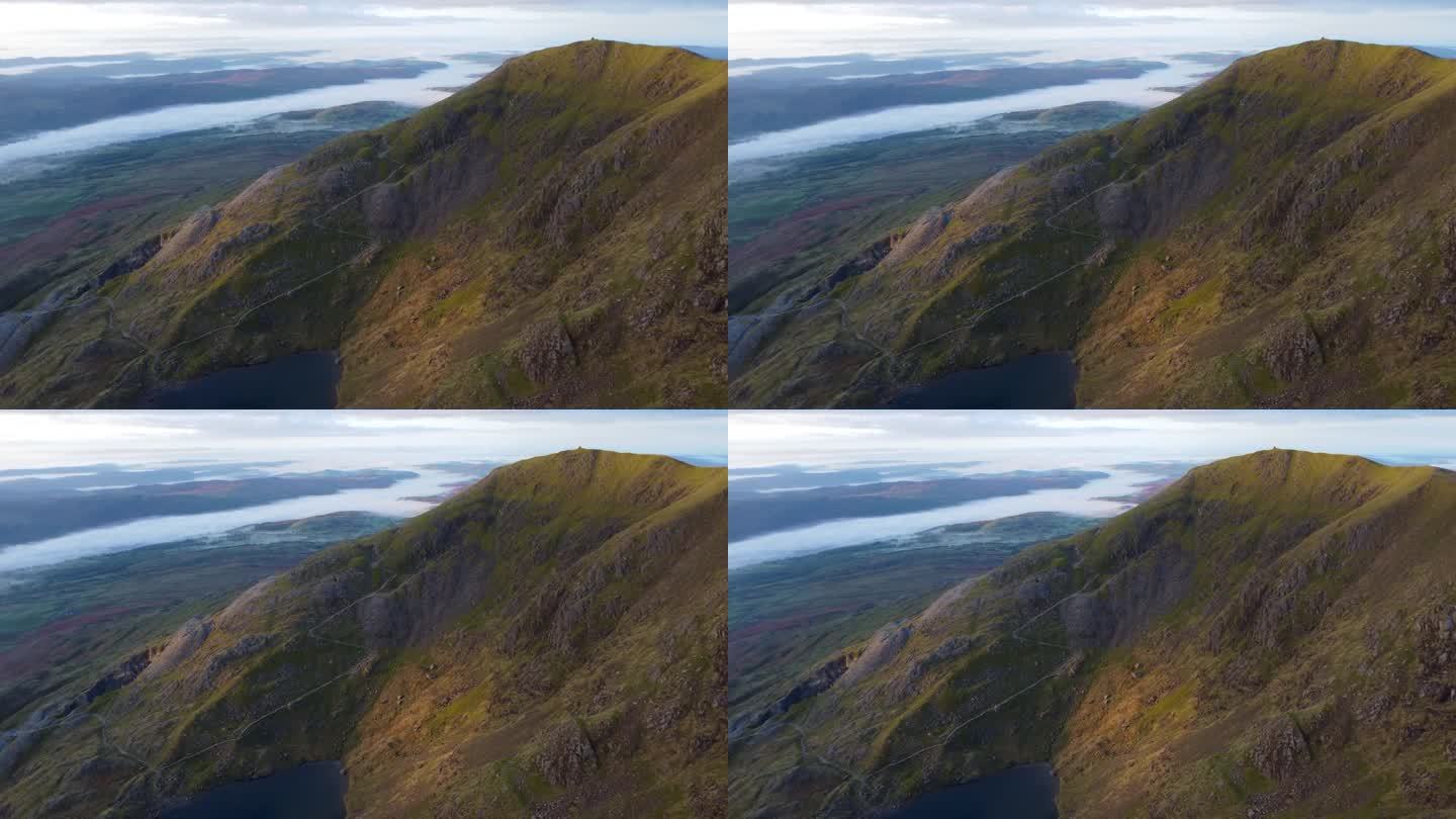 空中4K无人机拍摄的黄金时间的山与美丽的云在山谷中反转-在老人康尼斯顿，湖区，英国
