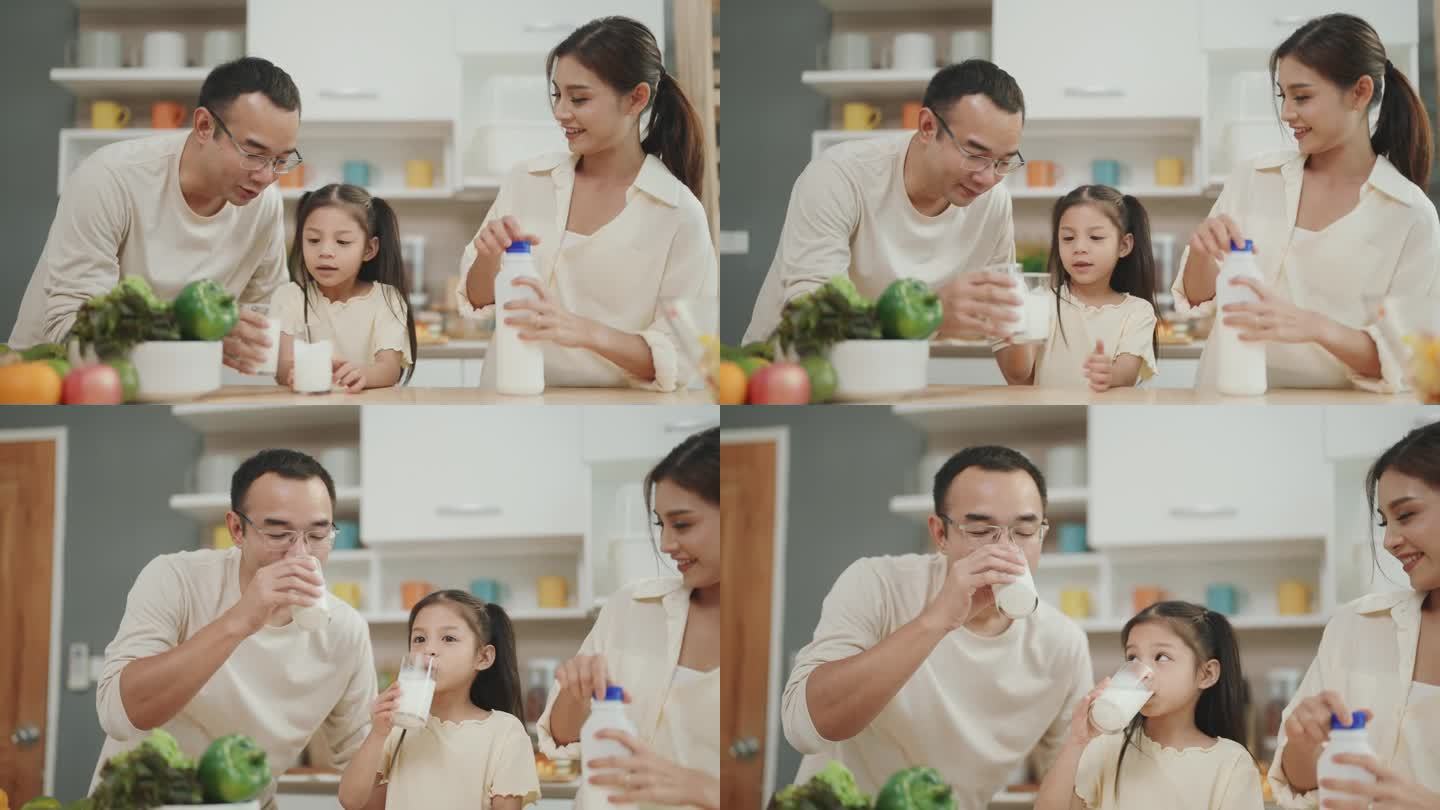 欢乐的家庭时刻:亚洲父母和孩子穿着休闲装，烹饪，在家一起享受健康的牛奶。