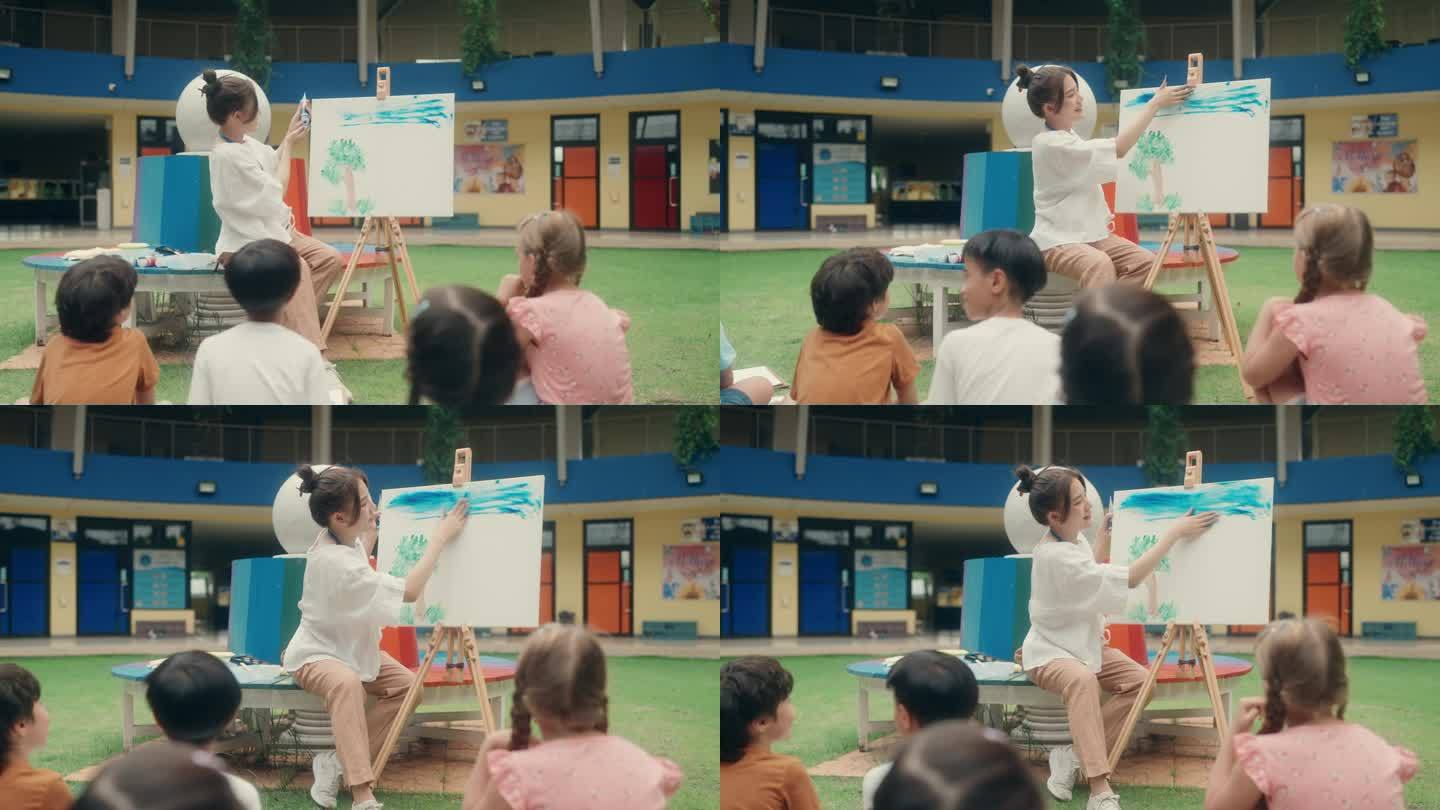 小学美术课:老师与孩子探索水彩技巧。回到学校。幼儿园。艺术家。手指绘画。