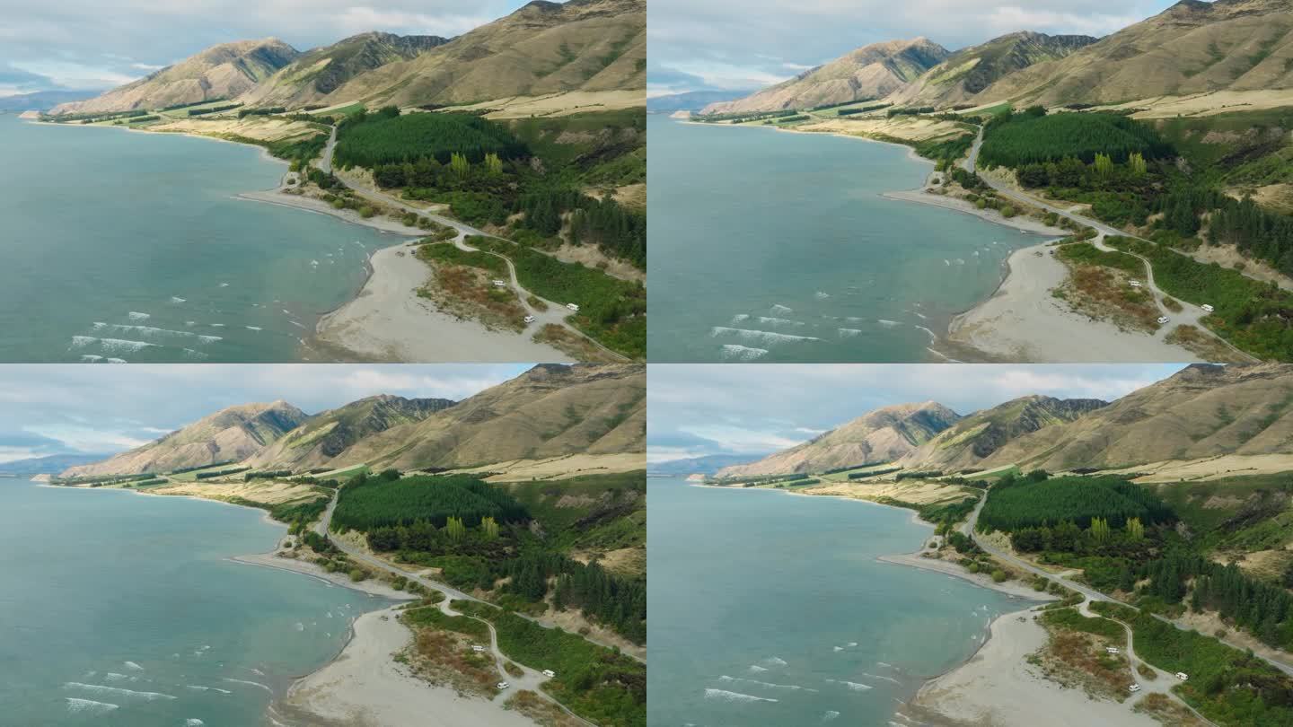鸟瞰新西兰南岛奥塔哥山区蜿蜒的道路和哈威亚湖