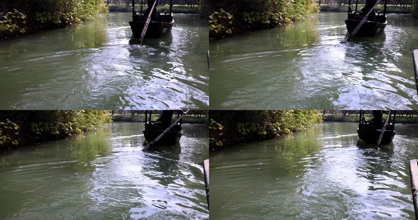 （慢镜头）小船河中前行船桨摇动特写