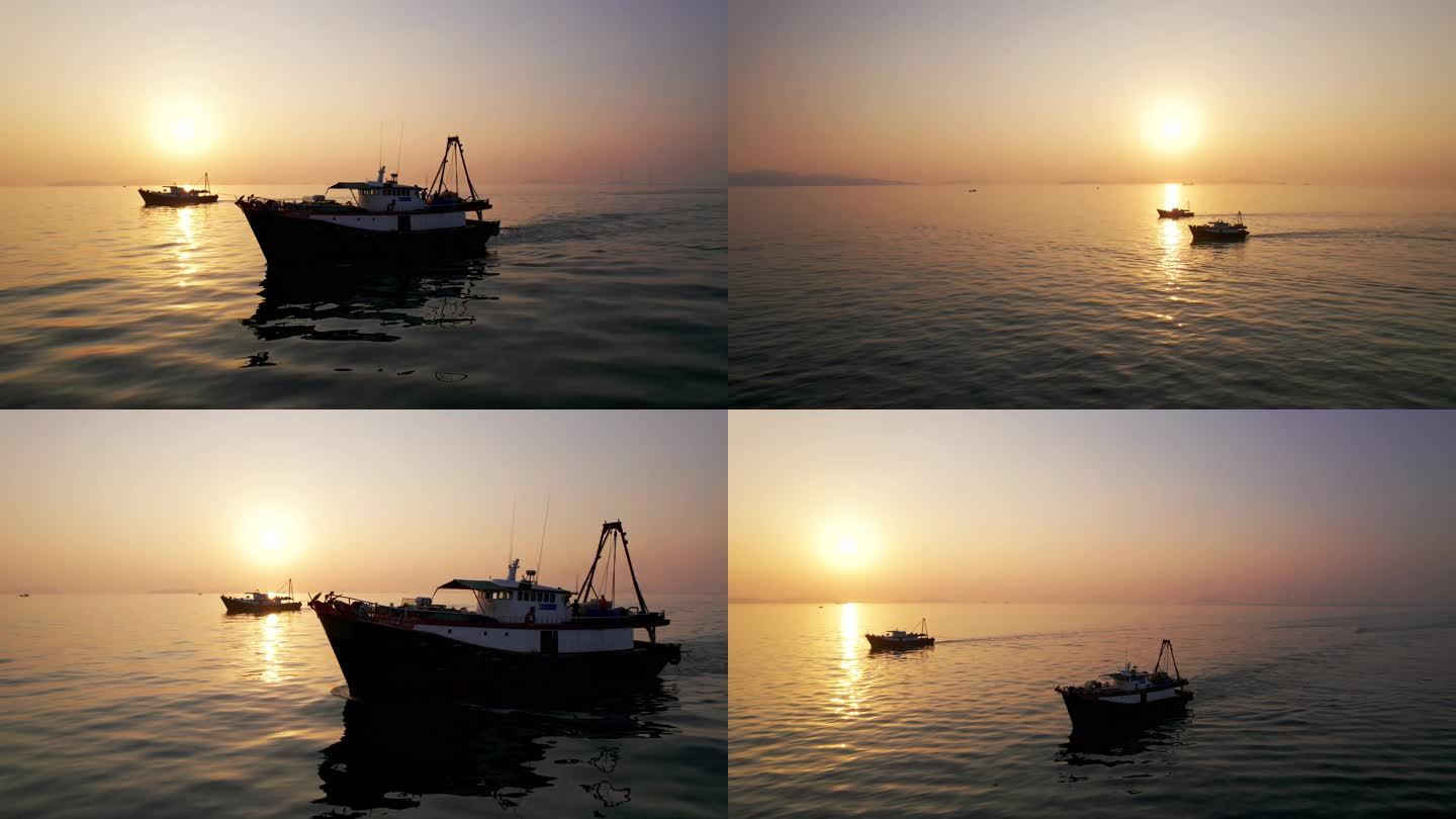 渔民日出捕鱼渔船出海海上日出日落渔业前景
