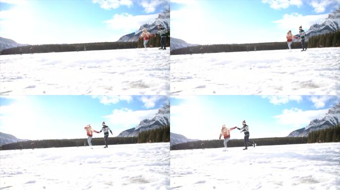 慢镜头:一对夫妇在结冰的湖面上滑冰