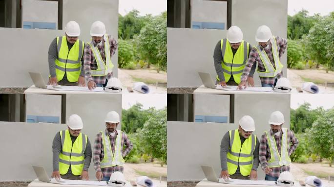 亚洲男性建筑师与建筑监理工人工程师雇员戴白色安全帽。与笔记本一起看结构图，指出需要固定的点。
