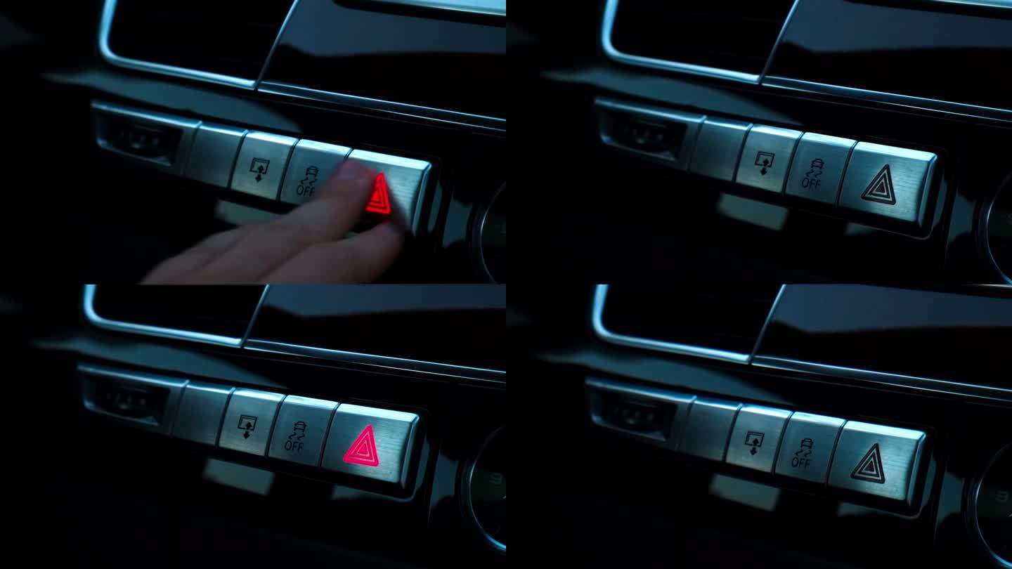 红色紧急按钮闪烁现代豪华轿车内部。详细介绍自动变速箱换挡，多媒体控制系统，汽车控制面板，通风口和仪表