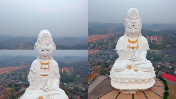 观音菩萨的雕像，清莱在笏怀普拉康。下降显示了雕像坐在山顶上的镜头