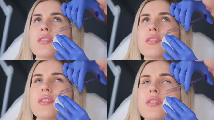 美容师给女性脸上注射肉毒杆菌来减少皱纹。