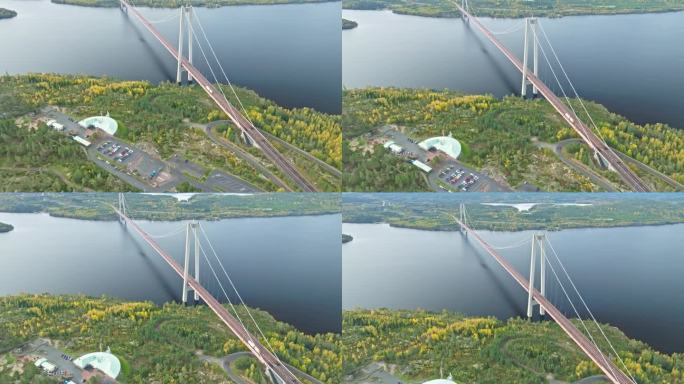 令人印象深刻的结构在瑞典Hogakustenbron桥。从上面看平静的大海和秋天的森林。空中拍摄