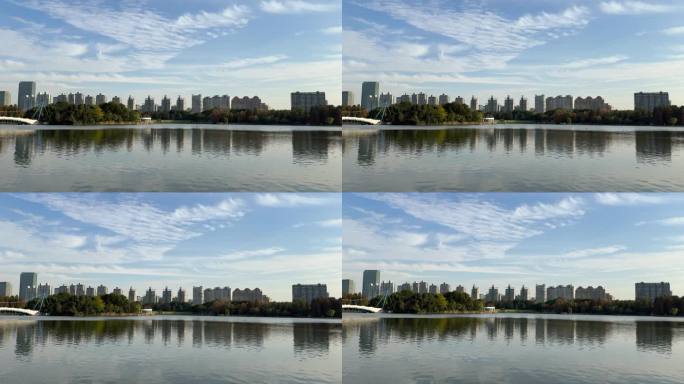 白云蓝天下的湖畔景色城市天际线风光