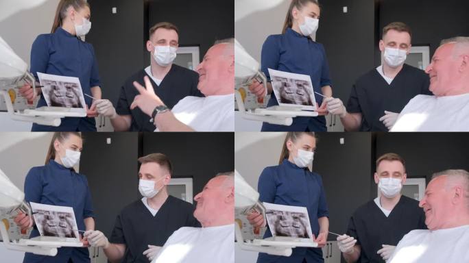 爷爷坐在牙医的椅子上，医生正在给他看牙齿的x光片。牙科的概念