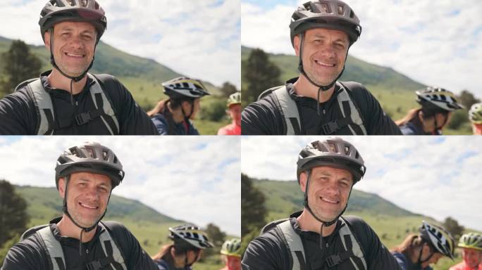 男山地自行车手在和他的朋友们上路前微笑